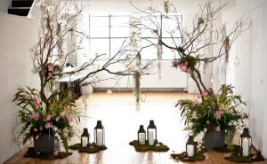 wedding decorations hanging from branches of trees