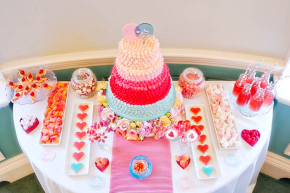 pink wedding dessert table with mini milk bottles