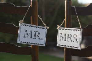 mr and mrs black and white wedding signs chair backs