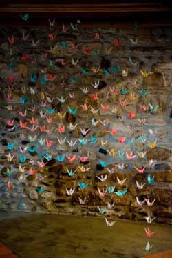 bright coloured paper cranes wedding backdrop