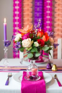 mini glass bell jar with macaroons fruit in bloved wedding styling