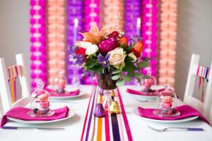mini glass bell jar with macaroons fruit in bloved wedding styling