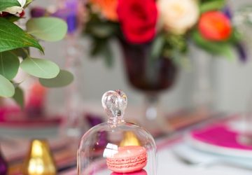 mini glass bell jar with macaroons fruit in bloved wedding styling