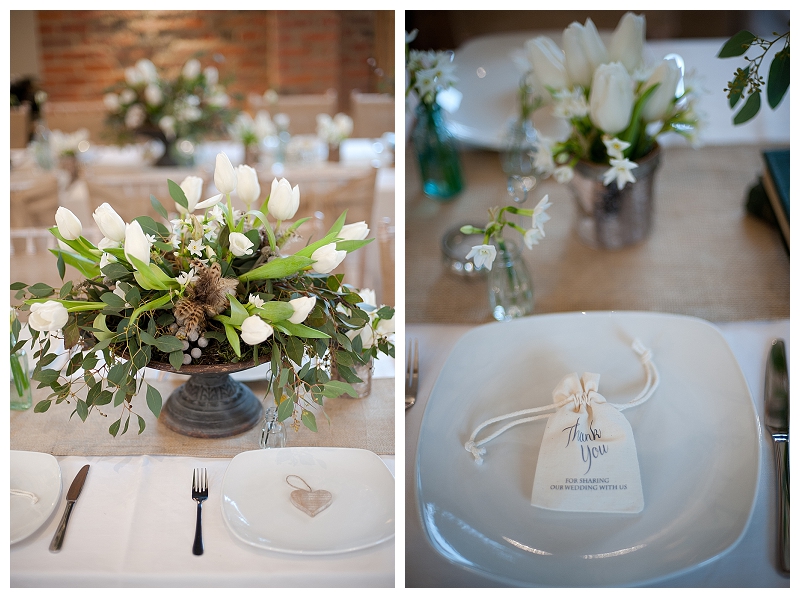 rustic urn wedding centrepiece white spring flowers on hessian runner