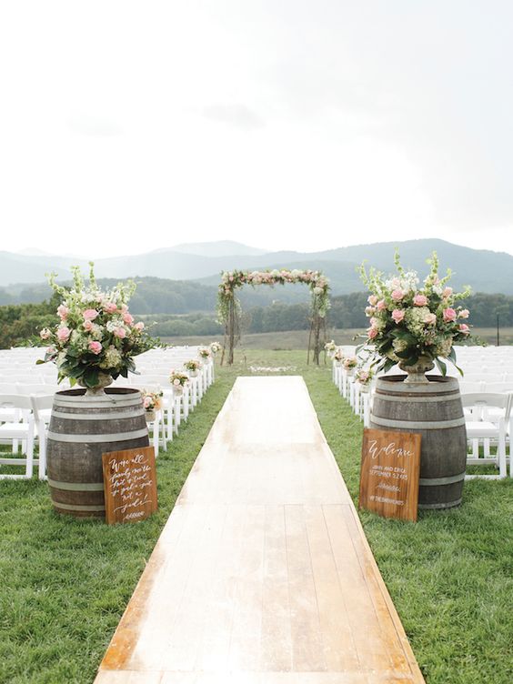 outdoor wedding ceremony wine barrels