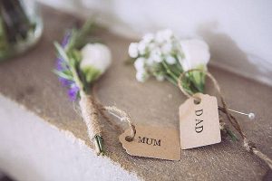 rustic wedding button holes with twine luggage tags names