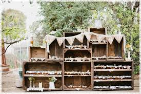 jam jar wedding favours on wooden crates shelving