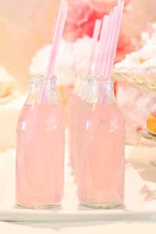 blush pink wedding ideas pink lemonade in milk bottles with pink straws