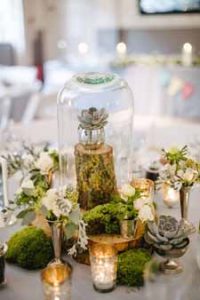 woodland wedding centrepiece ideas bell jars wooden tree slices and silver tea light holders