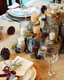 woodland wedding centrepiece ideas jam jar candles and stacks of wooden tree trunks