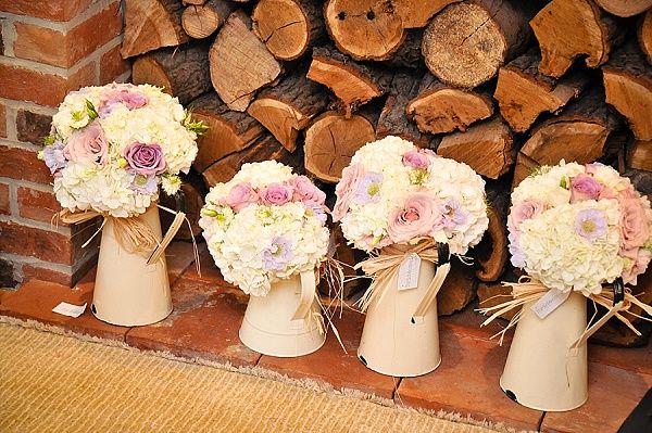 Cream jugs with bridesmaids bouquets