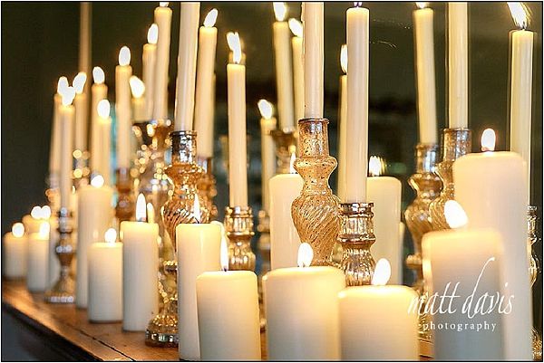 Mercury silver candle sticks on fireplace