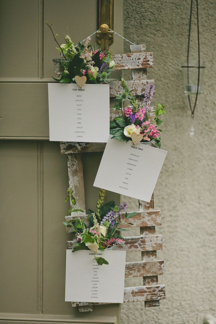 Rustic wedding table plan with flower pots