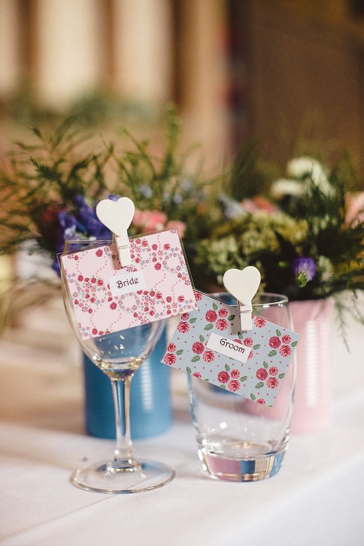 White heart pegs on wine glasses for place names