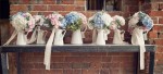 blue and blush pink wedding flowers - bouquets in jugs