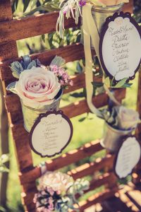 rustic wooden table plan with flower pots available from The Wedding of my Dreams