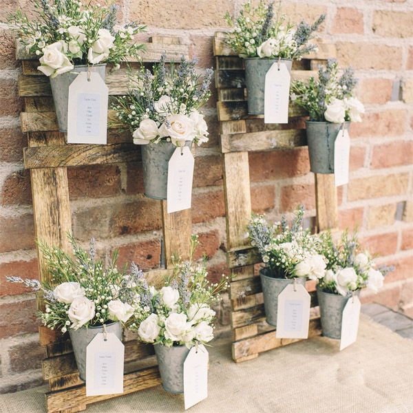 woodland wedding table plan made from wooden frames and flower pots