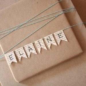 brown paper and paper bunting write recipients name on the bunting