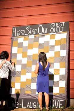 ask guests to sign a quilt or picnic blanet - wedding guest book ideas