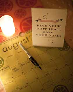 ask guests to write a note on their birthdays on a calendar wedding guest book ideas