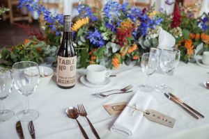 rustic table number stickers for wine bottle persolasied with name of couple - rustic barn wedding decorations