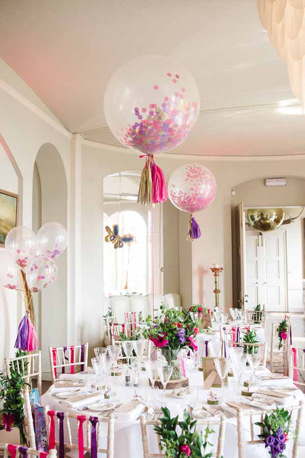 Tree slice Centrepieces with Giant Balloons Real Wedding at Aynhoe Park Bright Pink Fun Wedding Decorations (2)