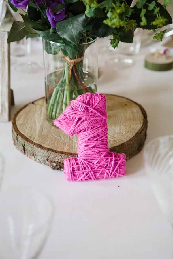 Tree slice Centrepieces with Giant Balloons Real Wedding at Aynhoe Park Bright Pink Fun Wedding Decorations (3)