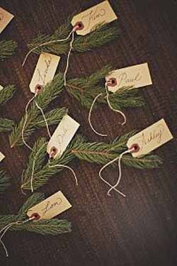 winter wedding place cards luggage tags tied to fir tree