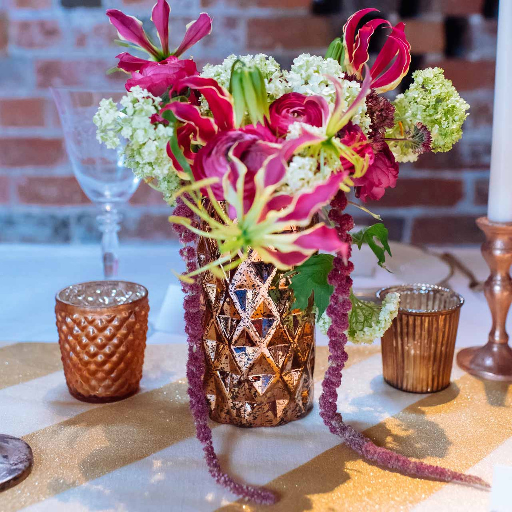 metallic-bronze-vases-for-wedding-table-decorations-by-@theweddingomd-metallic-wedding-ideas