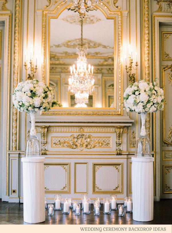 statement wedding venue with urns and candles - wedding ceremony backdrop ideas by @theweddingomd