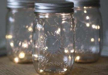 Mason Jar with Fairy Lights on tree slices for centrepieces available from @theweddingomd