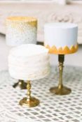gold-and-white-wedding-cakes-on-gold-cake-stands-200x300