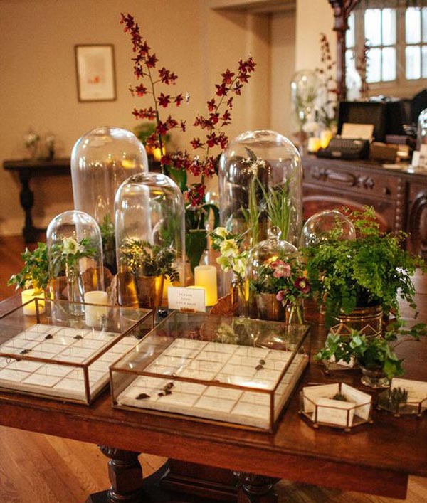 Love the idea of using bell jars of different heights at weddings on welcome tables or escort card tables