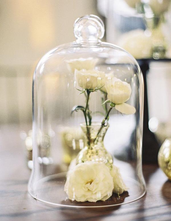 bell jars for wedding centrepieces, place a small bud vase withing the cloche