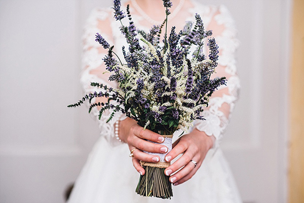 Pretty lavender bridal bouquet tied with hessian and lace wrap