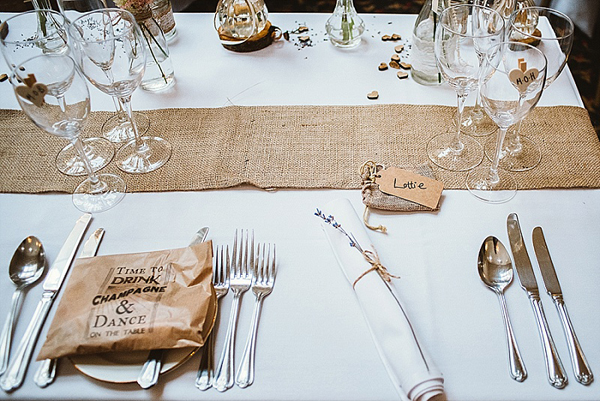 Rustic charm wedding usng hessian and lace detail Hessian table runner and burlap favour bags available from @theweddingomd as are the brilliant brown paper bags