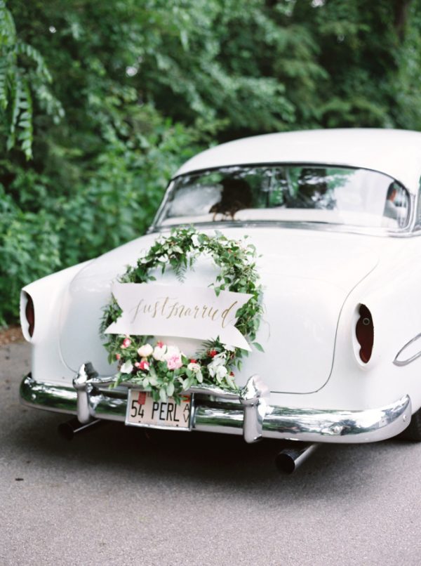 flower garlands and hoops wedding getaway cars