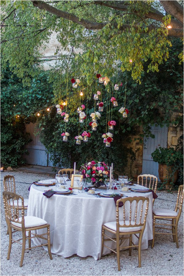 hanging vases above outdoor wedding tables - hanging vases available from @theweddingomd