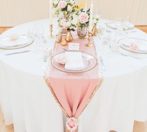 Pink and gold wedding table styling