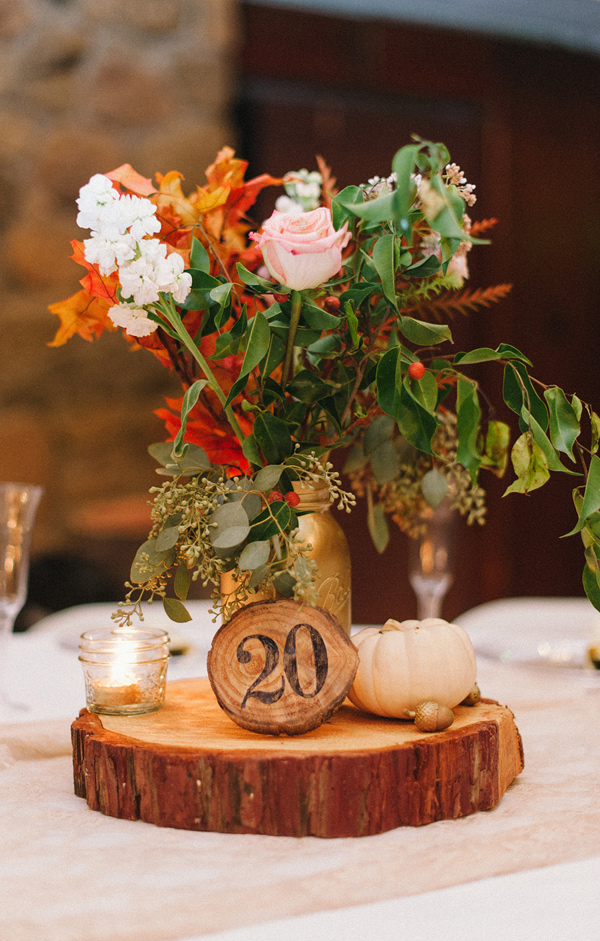 pumpkin wedding centrepieces on tree slices  ruffledblog-com-danielcruzblog-com