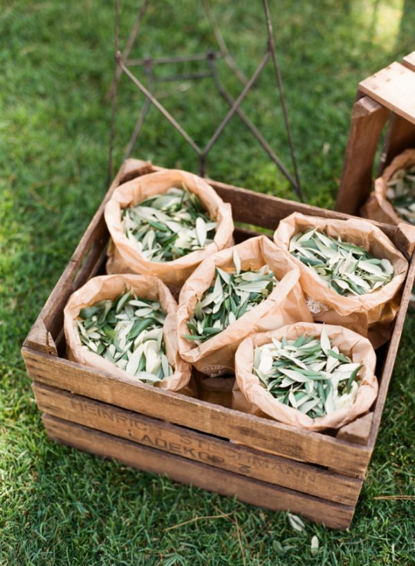 brown paper bags filled with olive leaves wedding confetti idea Italy