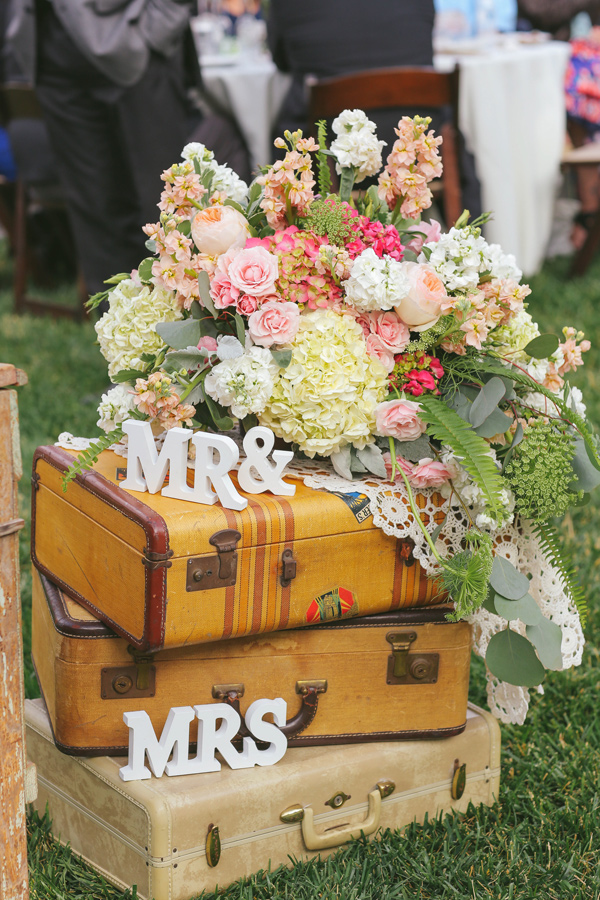 suitcases at your wedding Ruffled - photo by http://www.priscilavalentina.net/ - http://ruffledblog.com/bohemian-wedding-at-secluded-garden-estate