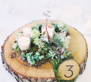 moss wedding centrepieces rustic tree slice