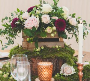 Featured Image wooden-crate-centrepiece-with-moss-and-copper-wedding-decorations-available-from-theweddingomd
