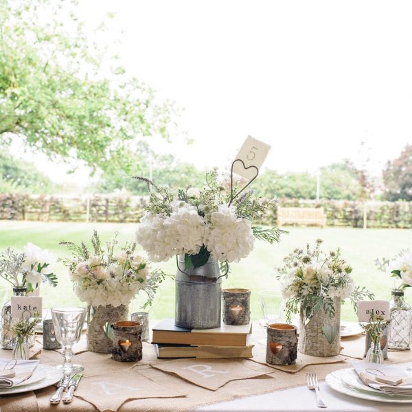 Our Favourite Wedding Centrepieces Under £15 available to buy online from @theweddingomd milk_churn_table_centre_4_1024x1024