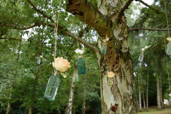 Pink Confetti Petals, Silver Candles & Love Is Sweet Favours Hanging roses in apothecary bottles - wedding flowers (1)