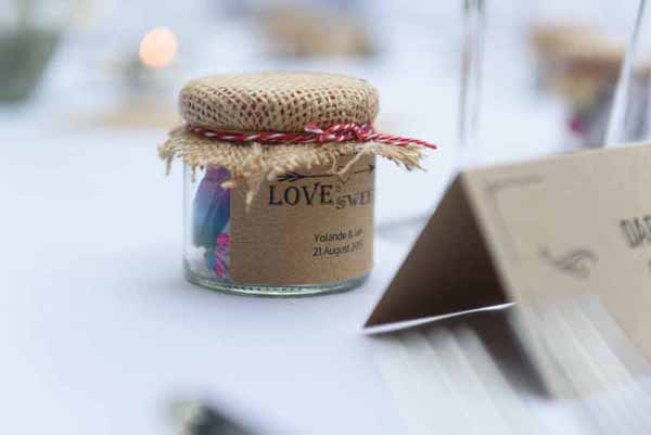 Pink Confetti Petals, Silver Candles & Love Is Sweet Favours Love is sweet wedding favours - stickers and jars @theweddingomd