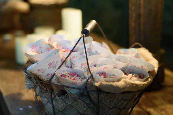 Pink Confetti Petals, Silver Candles & Love Is Sweet Favours Pink purple petal confetti in cones - available from @thewedding