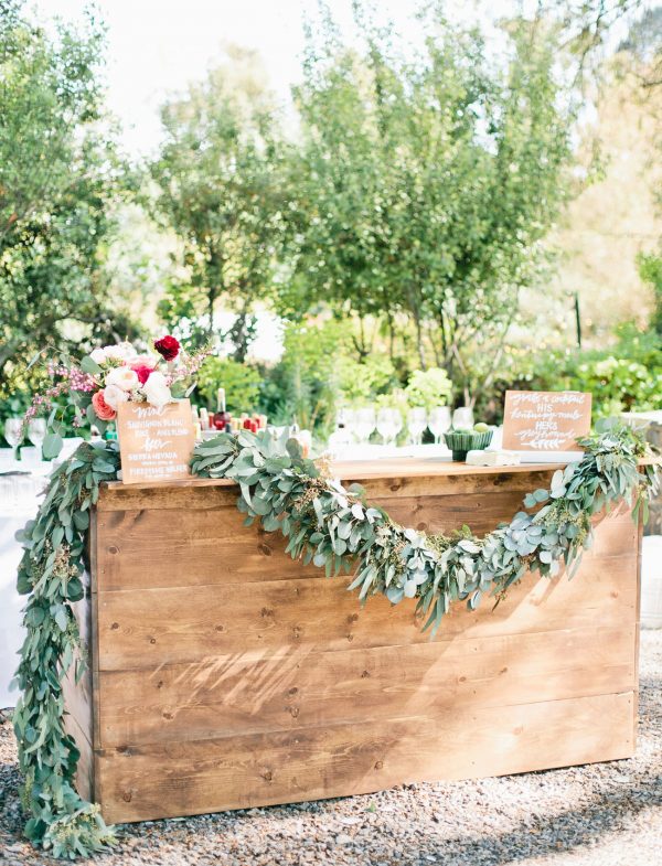 wooden wedding bar with floral garland