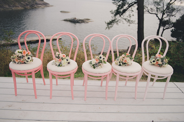 pretty bouquets on chairs wedding